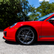 Steel brake rotors are hidden behind the T’s standard 20-inch wheels. I want the PCCBs.